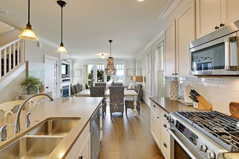 Beautiful kitchen with gas range and stainless steel appliances
