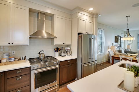 Beautiful kitchen with gas range and stainless steel appliances