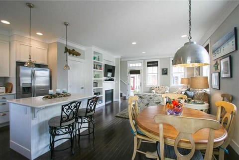 Plenty of seating at the dining room table and the kitchen island