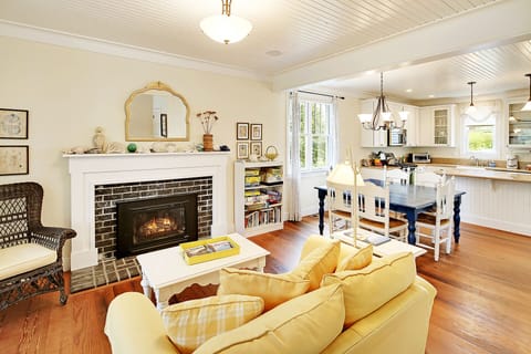 Open main floor with hardwood floors and gas fireplace