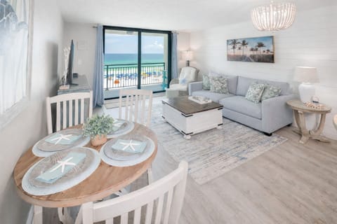 Bright beachside condo with ocean-view balcony and airy coastal living space