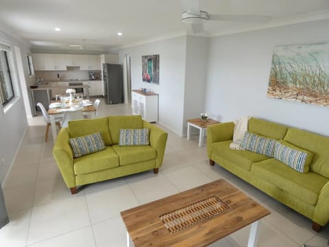 Lounge room, with a 42 inch television and air conditioner. 