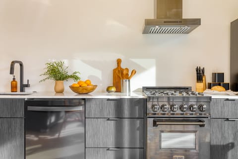 Modern appliances, including a gas range.