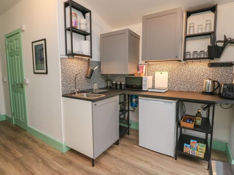 Fridge, electric kettle, toaster, cookware/dishes/utensils