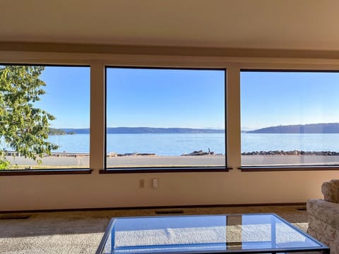 Relax in the living room to this view. Watch the activity on the water as paddle boarders, boaters, paddlers, walkers and cyclists pass by. You will even get a show from the Naval Air Station Whidbey Island (NASWI) which is located in Oak Harbor.