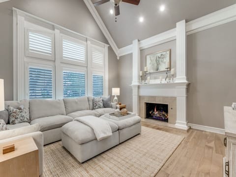 Super comfy living room, large couch and 75`TV with gas log fireplace