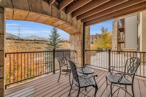 Enjoy the fresh mountain air and surrounding views from the condo’s private balcony.