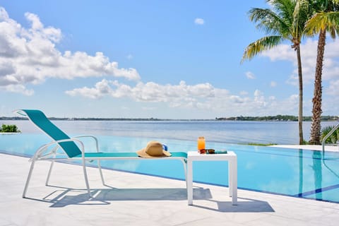 2 outdoor pools, open 8:00 AM to 7:00 PM, pool umbrellas, sun loungers