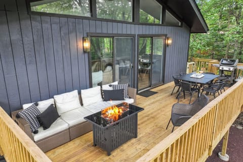 Cozy up by the propane firepit on the elevated tree-top deck this spring.