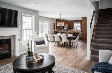 Unwind in the living room and take a peek into the kitchen to see dinner being crafted by the experts. Get cozy with a coffee or Sudoku around the coffee table - complete with stools for extra seating, game night fun, or just somewhere to kick back.