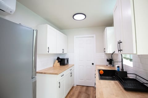 Elite Cabin, Beach View | Private kitchen | Mini-fridge, microwave, coffee/tea maker, dining tables