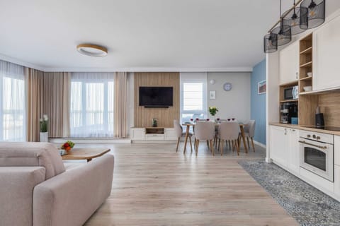 A wide-angle view of the living space, showcasing the harmonious interior design.

