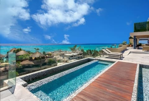 Shared rooftop pool with ocean views