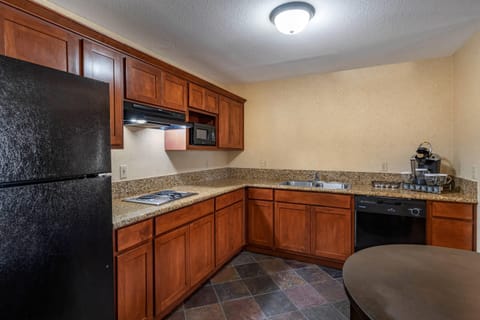 Desk, laptop workspace, blackout drapes, iron/ironing board