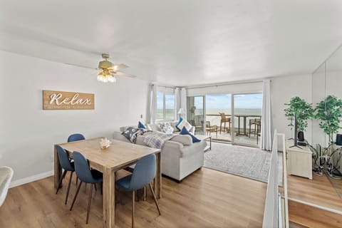 Relax in the spacious living area with stunning ocean views. 