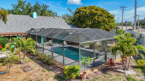 A serene getaway with total privacy, featuring an inviting pool, a cozy fire pit, and garden seating. 