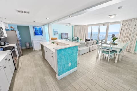 Step into your bright oceanfront haven where turquoise accents mirror the sea beyond your windows, creating a seamless coastal escape.