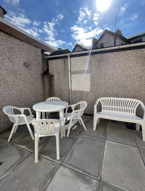 Outdoor area with table and chairs.