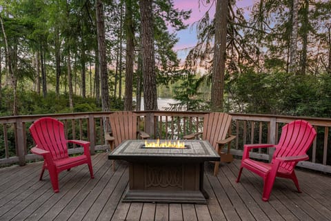 Expansive deck overlooking the inlet with propane fireplace.