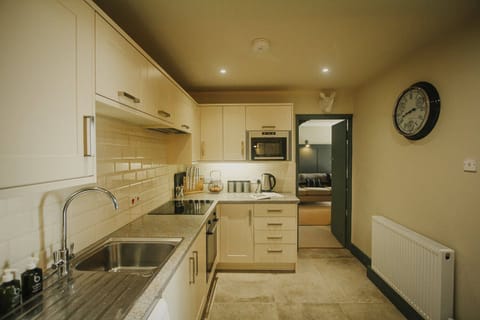 Open plan kitchen with access to lounge