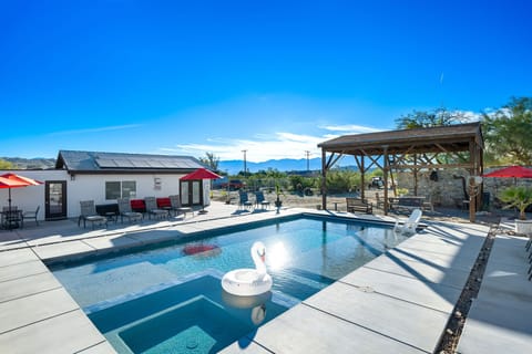 The pool has two large shallow decks with the ability to hold a sun umbrella 