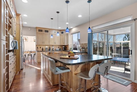 Our updated kitchen is a chef's dream, with all of the appliances you could need and a large island with additional seating. It's the perfect place to cook a delicious meal for the whole family!