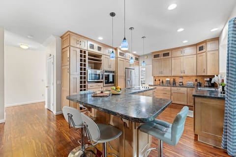 Our open concept kitchen is fully updated with modern counter tops, storage, and appliances.