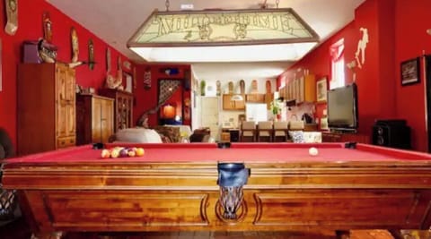 Great room with pool table and kitchen.