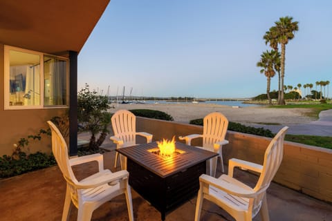 This patio offers perfect Bayfront views, ample seating, and a fire pit.