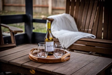 Enjoy a relaxing glass of wine with friends in the outdoor pavilion.  This space is both private and comfortably furnished with local Amish-made furniture. 