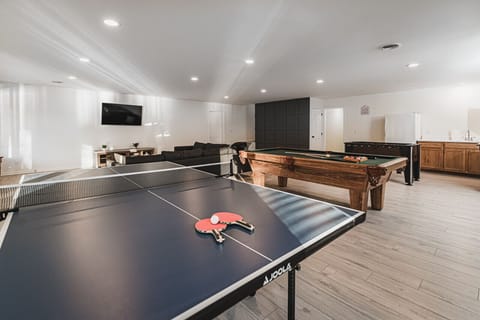 Ping Pong, Pool, Fooseball and a kitchenette to play games, watch sports, and relax after a day on the water