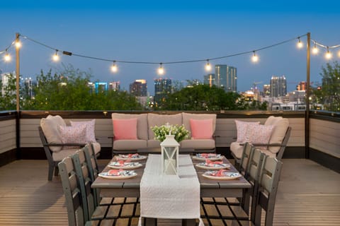 [Casa Rosalie] The Insta-Ready Rooftop Patio Offers a Beautiful View of the Nashville Skyline.