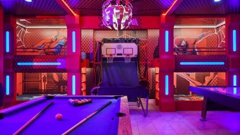 Ultimate Spider-Man arcade with bunk beds, basketball, pool, and air hockey fun.