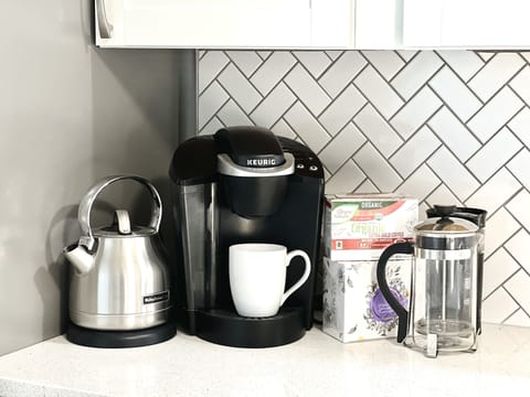 Coffee station, with drip coffee maker, Keurig, and french press.