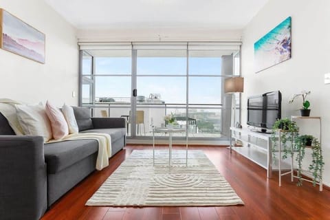 A spacious living area with a 3-seater sofa bed.