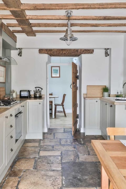 Fully fitted kitchen with original flagstone floor tiles