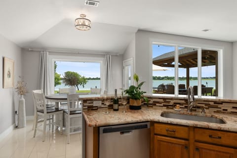 This mesmerizing lake view from the kitchen sink can make washing dishes a easy!