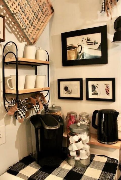 Grab your morning hot beverage from the coffee and tea bar with pod-style coffeemaker plus pods, electric tea pot, and coffee/tea supplies.