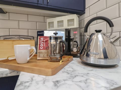 Fridge, electric kettle, toaster, cookware/dishes/utensils