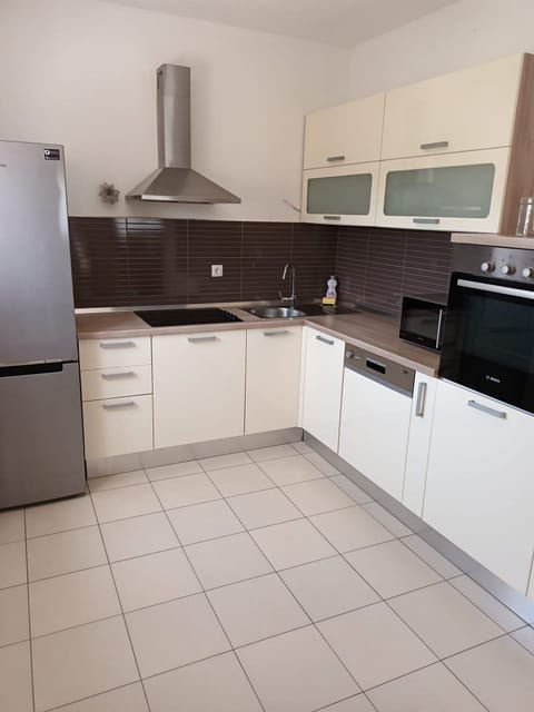 House (Three Bedroom Holiday Home with Terra) | Private kitchen | Fridge, dining tables