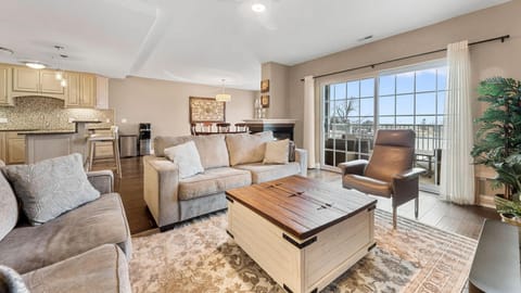 Spacious living room with comfortable seating and scenic window views