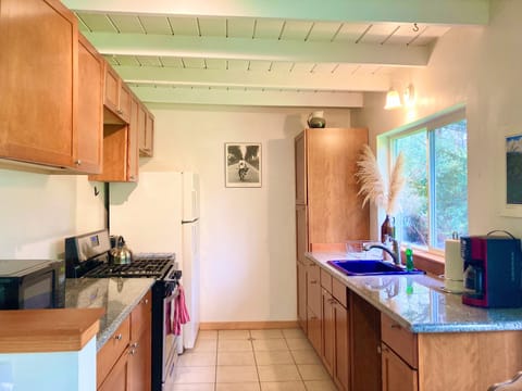 Azul kitchen with coffee maker, microwave, tea kettle, toaster, pots & pans 