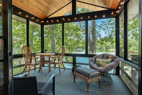 Enjoy your morning coffee or happy-hour in the tree-house-like screened-in-porch
