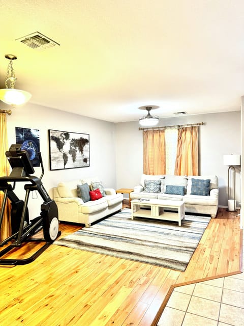 Gorgeous Living Space with Elliptical, Television, Sofa & Loveseat perfect!!