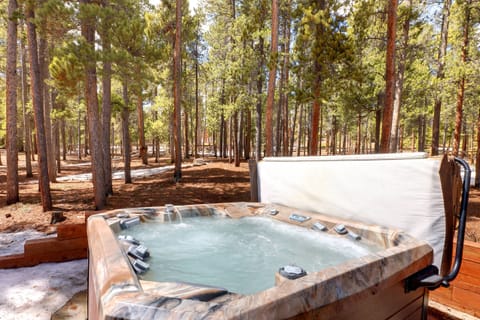 A private Hot Tub is situated in the backyard with a beautiful view of the woods and sometimes even deer. 