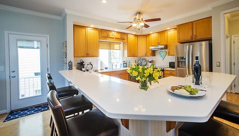 Large fully appointed kitchen with plenty of countertop space and seating for 5.