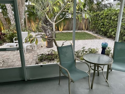 Private outdoor lanai with access to fully furnished tropical backyard