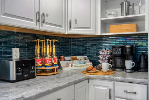 Dedicated coffee bar with Keurig K-Duo, French press, and essentials provided.