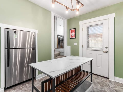 Kitchen island has dining seating - additional seating in living area