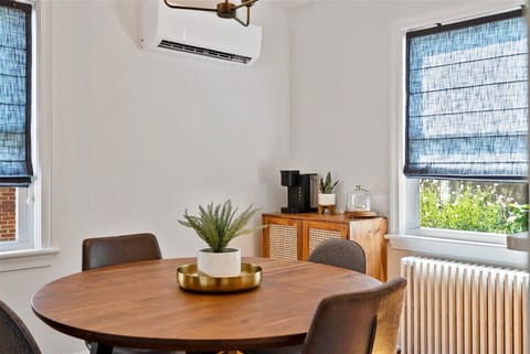 Dining table for seating in the dining room, w/ a coffee bar, and great lighting